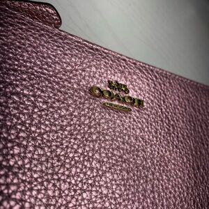 COACH Pink shimmery wristlet. Brand new (no tags)